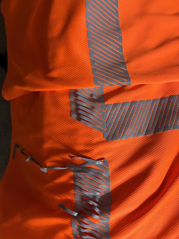 2 shirts bought together and washed and dried together , 1 of the reflective strips is completely