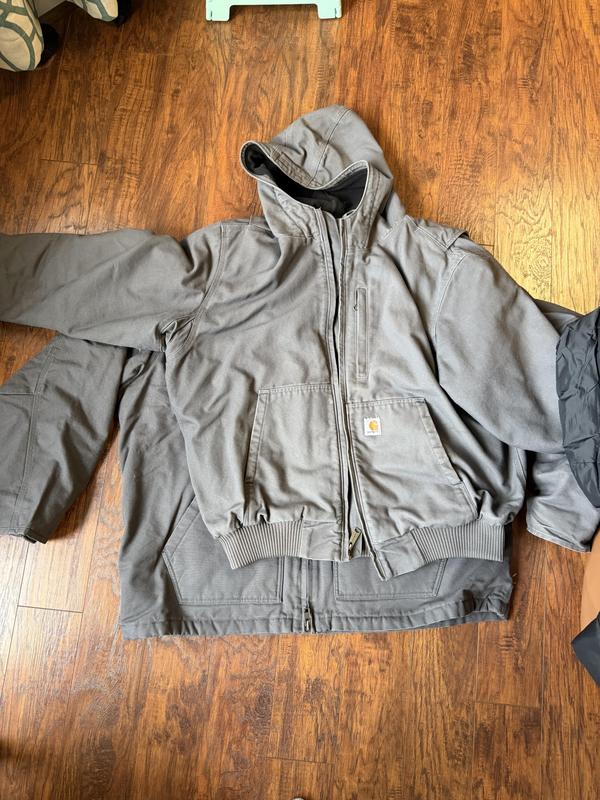 Old 2X jacket pictured on top of a new 2X jacket.   It's roughly 4" longer and 7" wider throughout.
