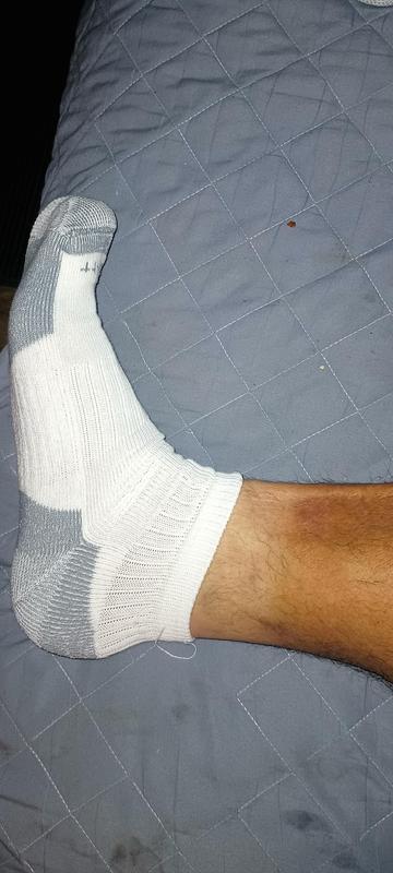 Fits like an ankle sock and is below the top of the boots I wear.  So won't work for me.