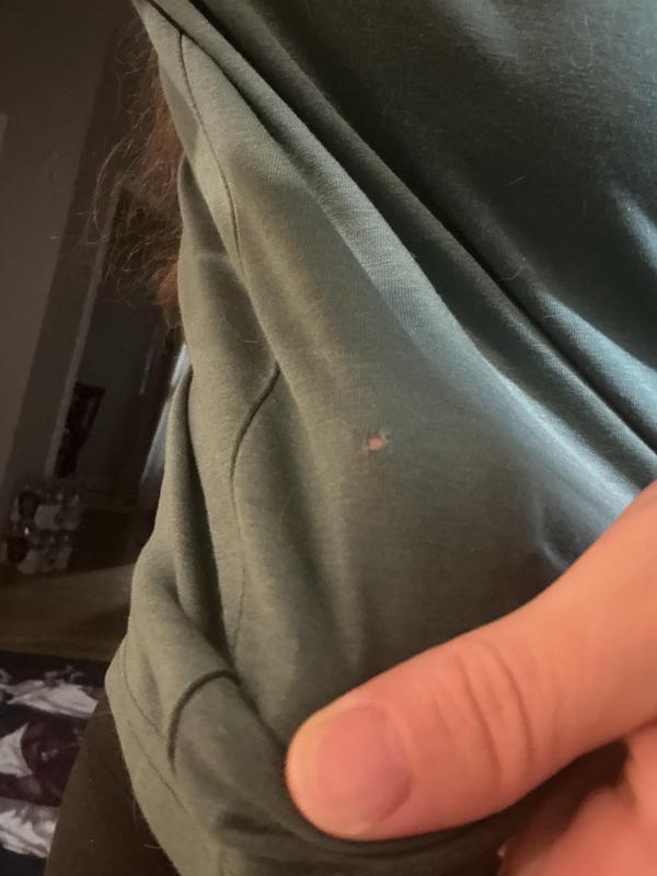 Shirt was straight out of the plastic and already had a pencil sized hole.