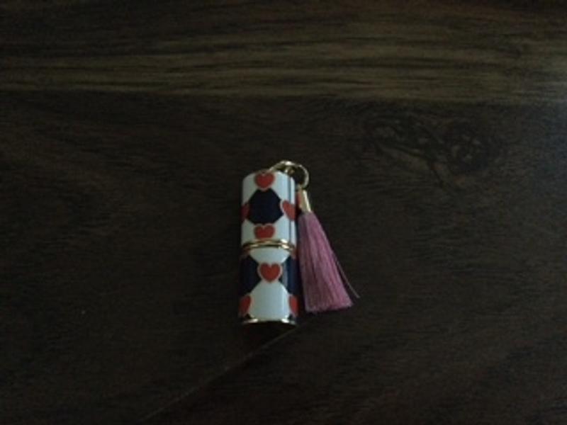 Lovewins lipstick cap with tassel.
