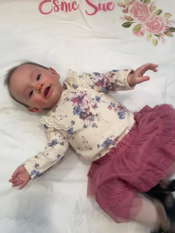 This was her 6 month picture. Also goes get with jeans and jeans jacket