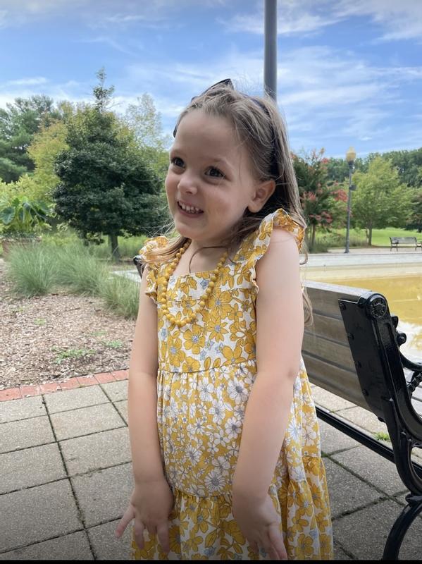 Daughter forgot how to smile like a human being, but I promise she was happy here. The dress was beautiful and she loved showing it off.