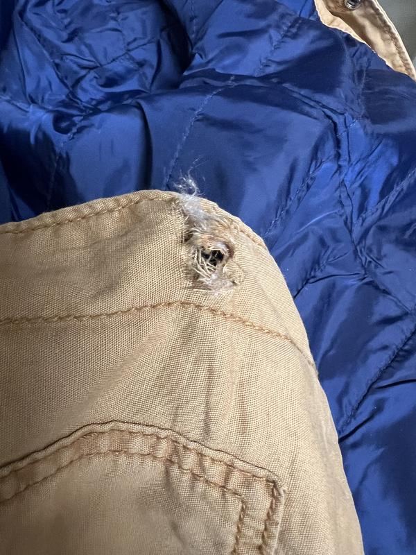 Button pulled through fabric