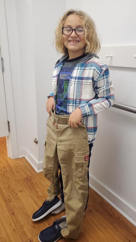 Grandson modeling and justifying new shirt will go with pants/shoes he wore in. :-)