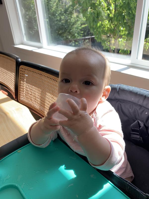 A happy sunny morning in my new pink stripped carters onesie.