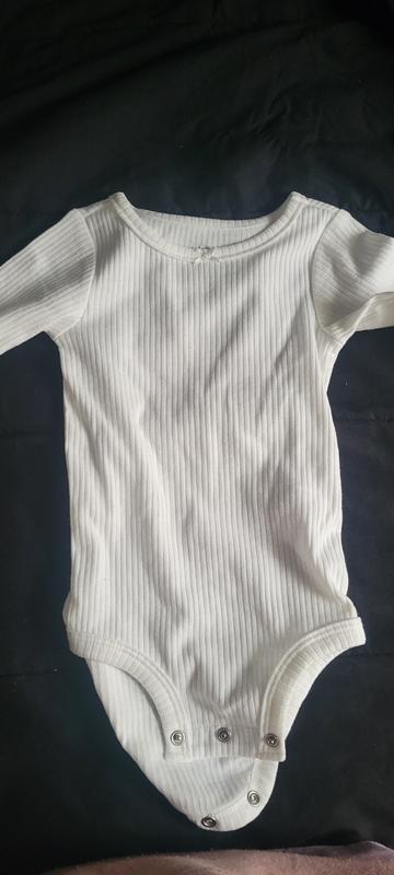 One of the white bodysuits