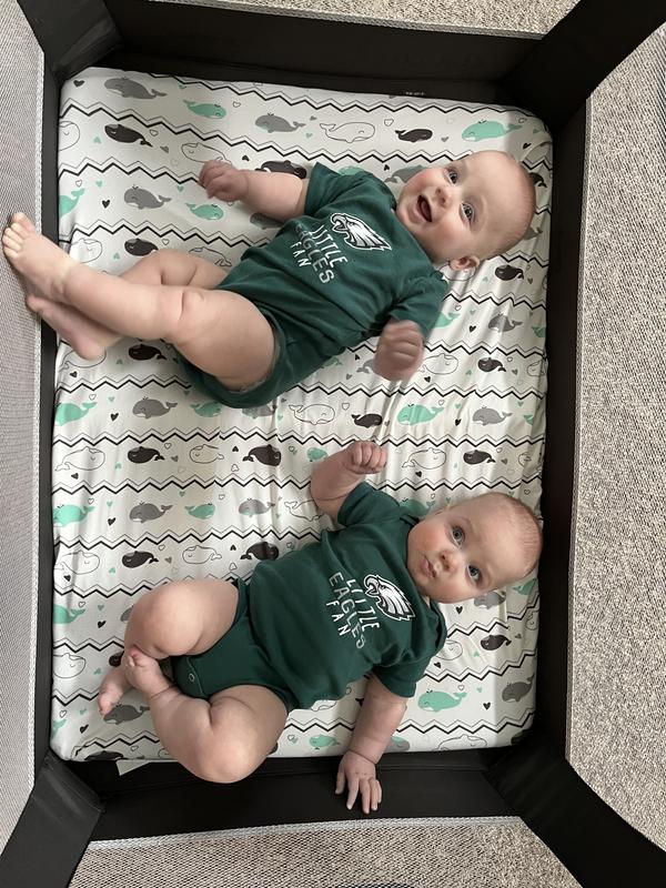 Twins in Eagles onesies.