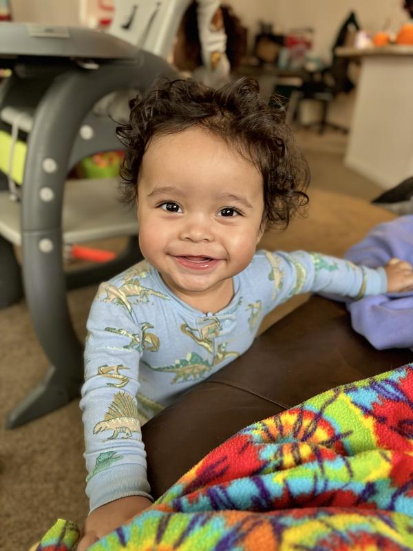 Big smiles in his dino pjs!