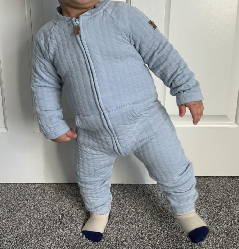 16 month old wearing 24 month jumpsuit
Baby is 32 lbs and 31 inches tall