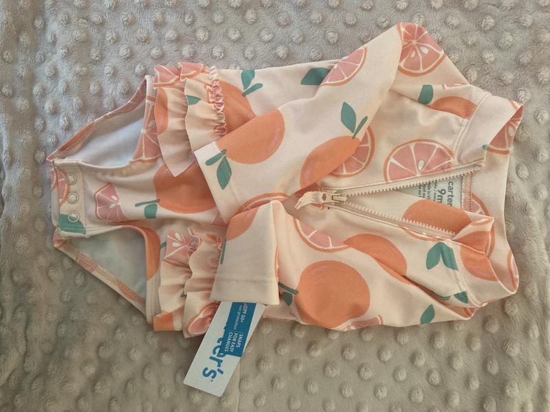 Cutest ruffles and zip up- cute oranges print but was too small for our 5 month old
