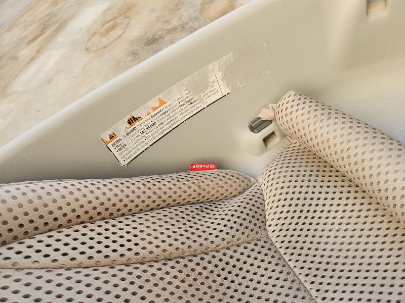 Mold and sticker particles in bath tub