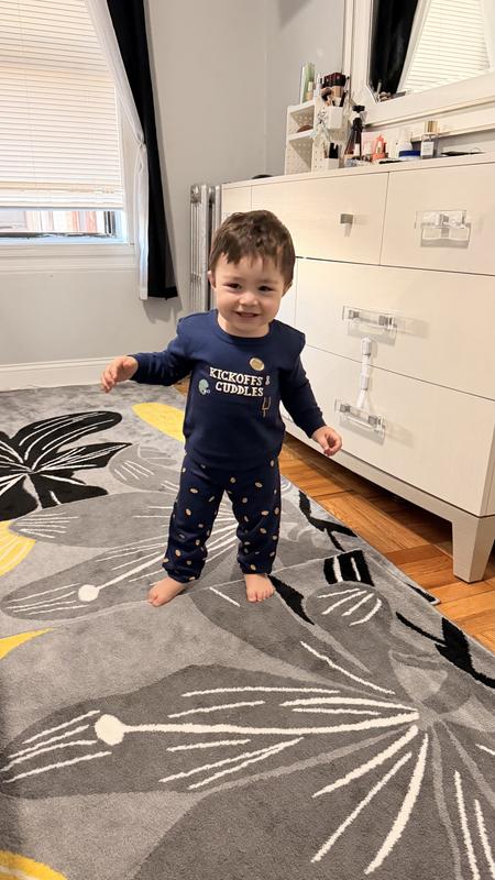 My son wearing his new football outfit.