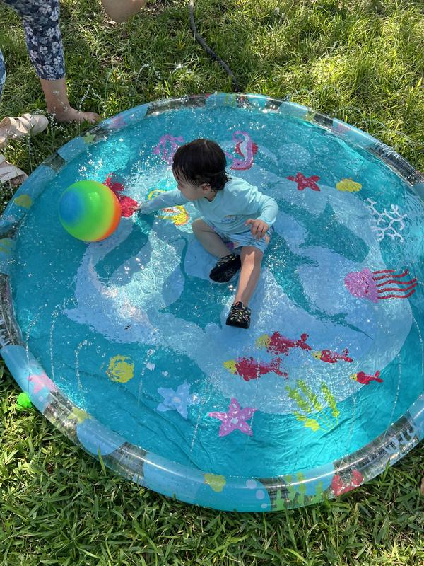 He had fun wearing his new swimsuit in the baby pool!!