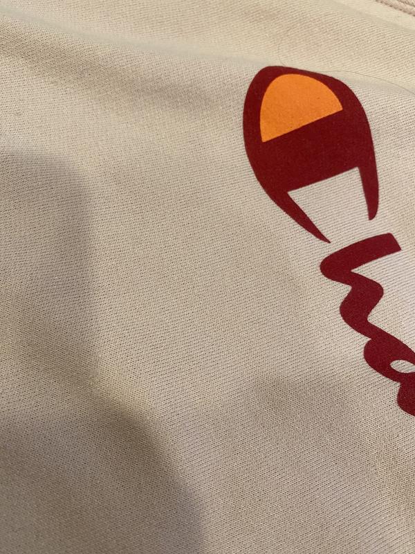 Pilling front of sweat shirt and round front pocket.