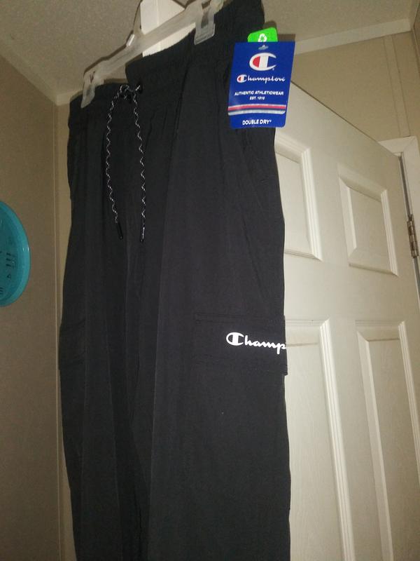 The side of the pants with champion logo on the cargo pocket and the other side also have a pocket without the logo