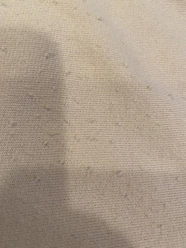 Pilling front of sweatshirt and around the pocket