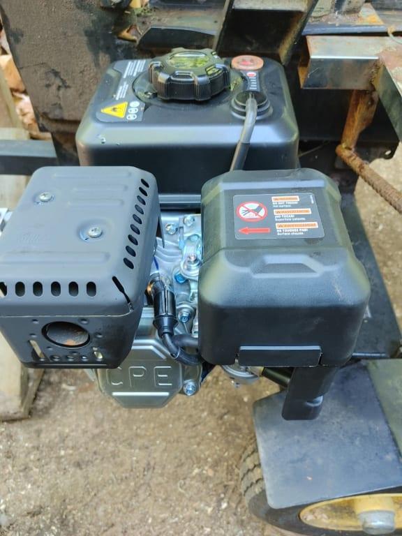 Fuel tank air filter and muffler improvements