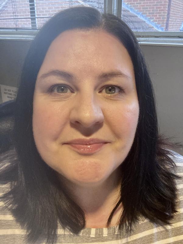 Full, natural face of Charlotte Tilbury, inc. the lip elixir.