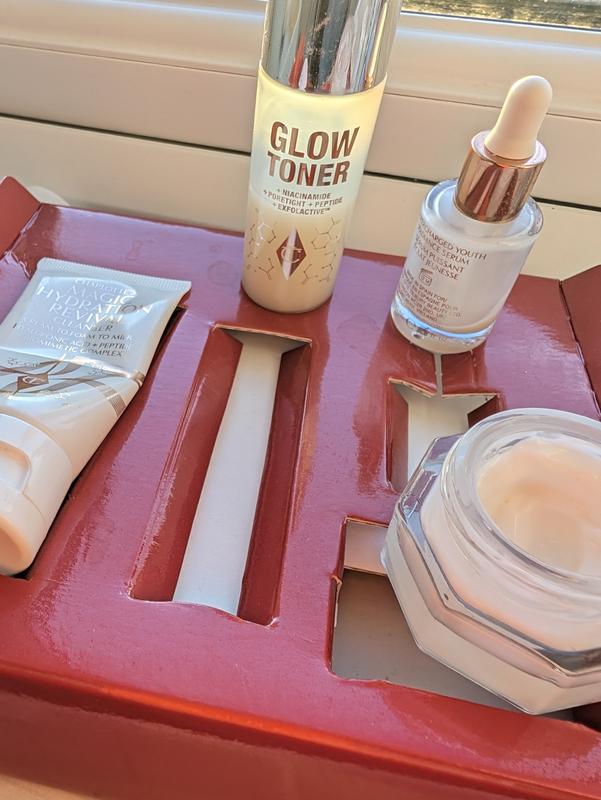 Customer photo for "The Charlotte Tilbury Magic Skin routine completely transformed my complexion, leaving it instantly hydrated, smooth, and naturally radiant."