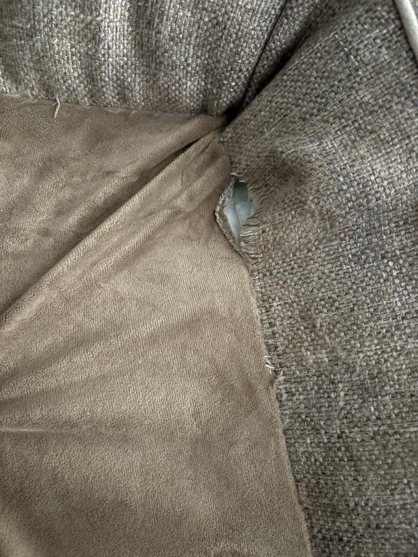 Ripped along the seam.