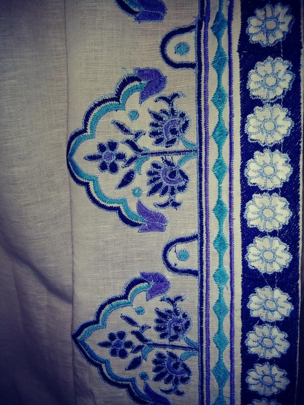 Beautiful embroidery, but more purple than expected. Fabric has nice texture, but looks a bit frail when front-lit (I used the flash in this photo).