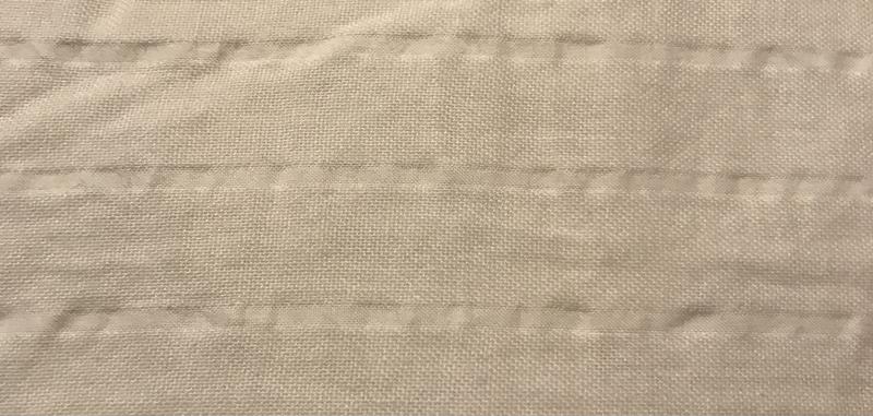 DKNY PURE Comfy Comforter close-up in white option.