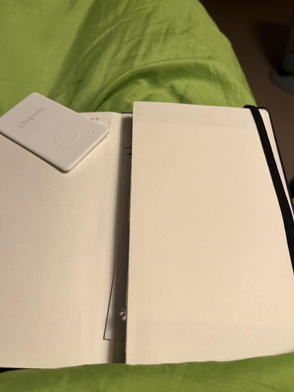 Chipolo card in an important diary or wallet.