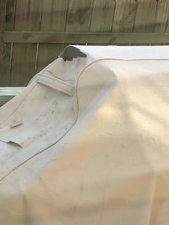 tear in cover after snow melted