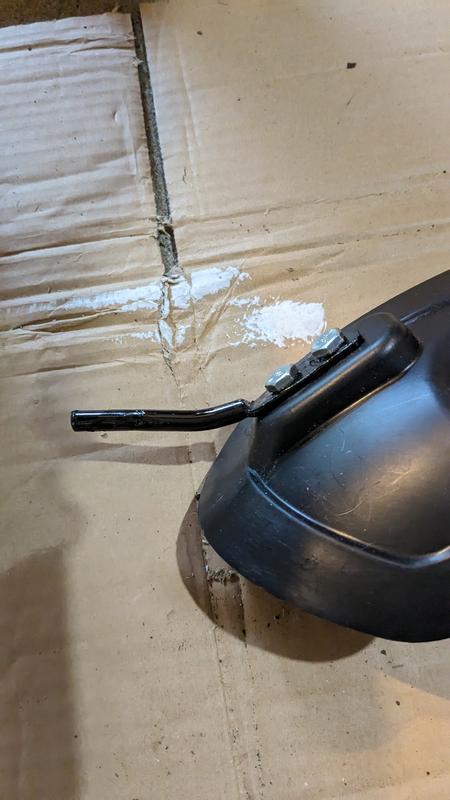 mulch plug with modified mounting rod, bent, straightened, and re-angled to position the plug correctly.