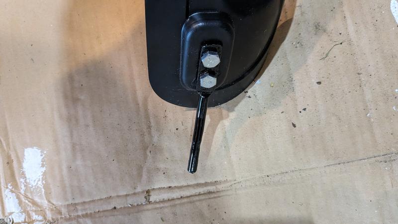 another angle of mulch plug with modified mounting rod, bent, straightened, and re-angled to position the plug correctly.