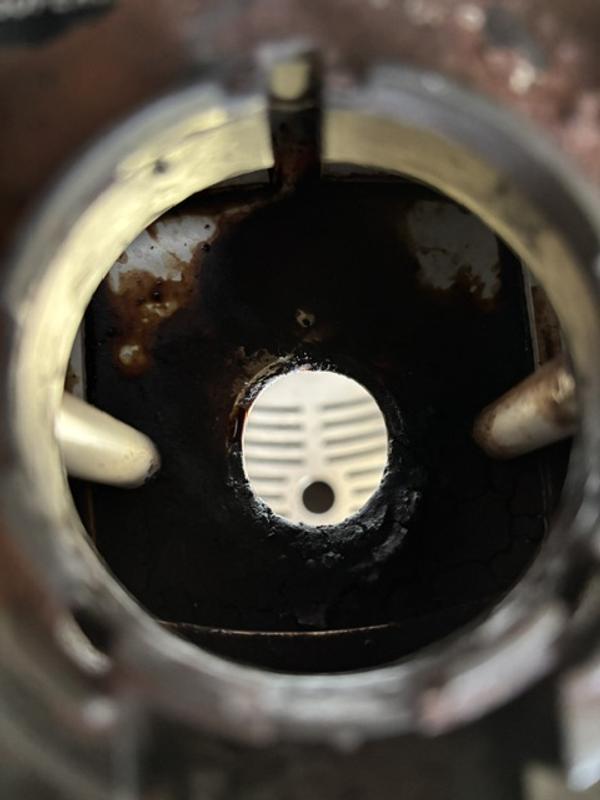 Metal getting corroded with coffee and water; can't get to it to clean because of the needle.