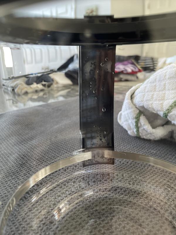 Water trapped between the glass and handle