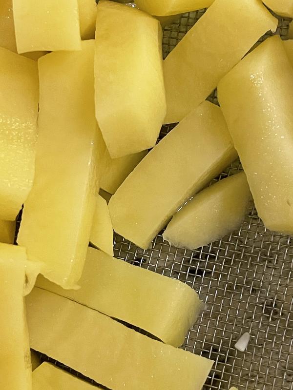 White plastic shavings on the potatoes.