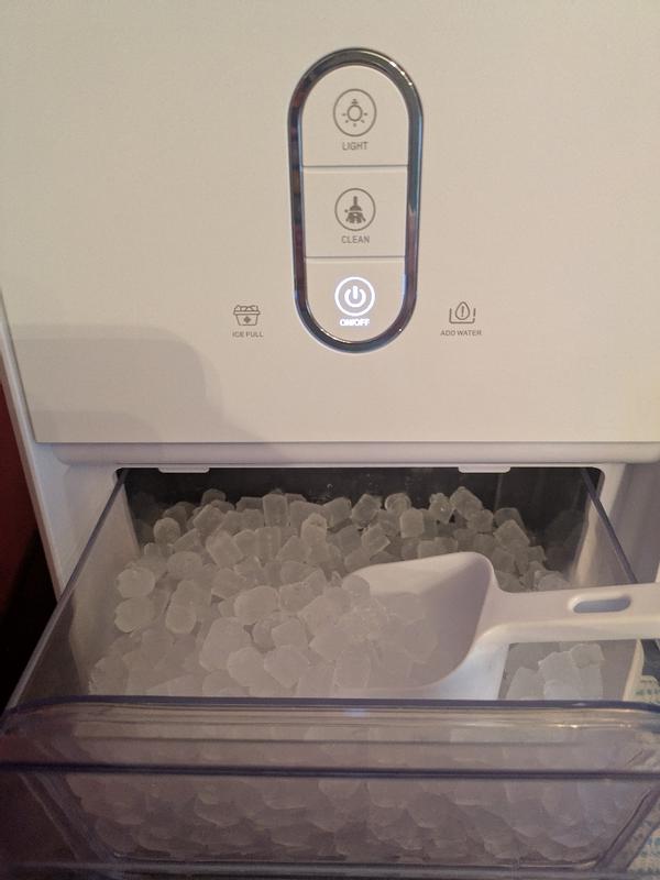 Ice maker with fresh ice and scoop