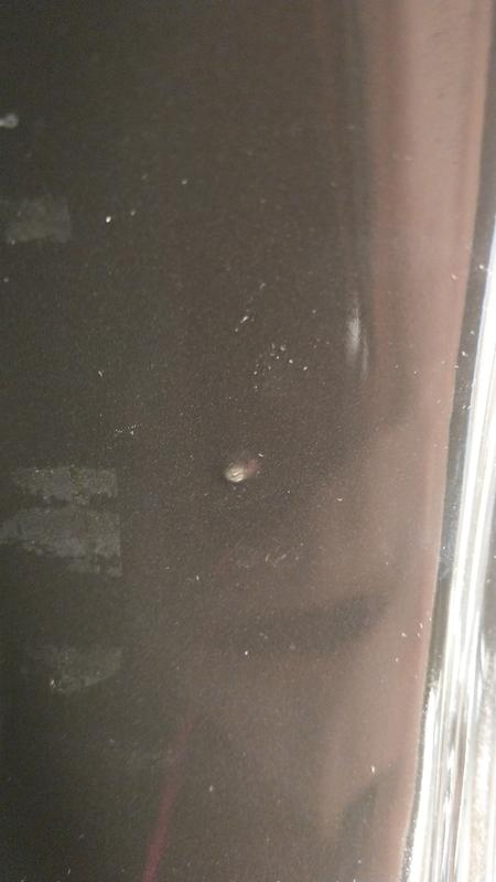 Lump in ceramic/bubble in coating?