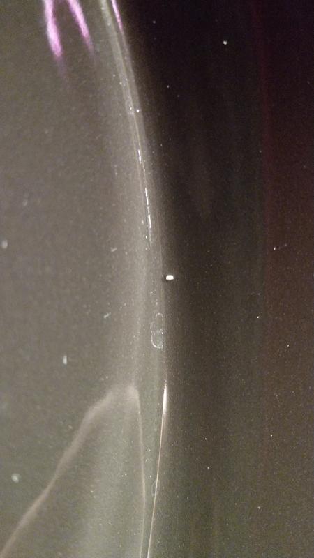 Lump in ceramic/bubble in coating?