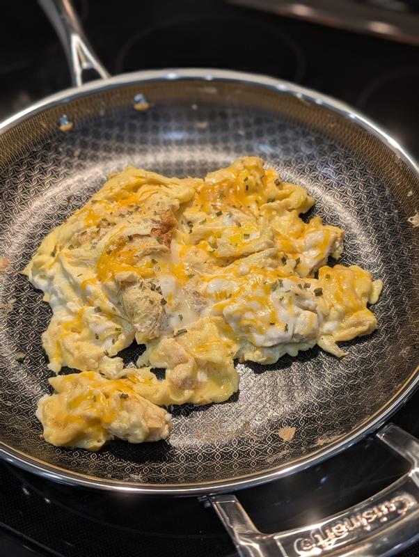 Scrambled eggs sit in a Cuisinart FusionElite  Nonstick Tri-Ply Stainless Steel Skillet