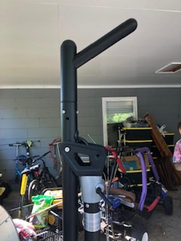 Pulling the pin allows you to place the heater in a down position. There is also the handle you use to swivel it around