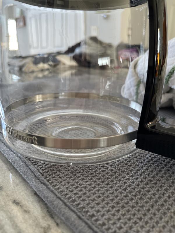 Water drips from between the glass and plastic rim