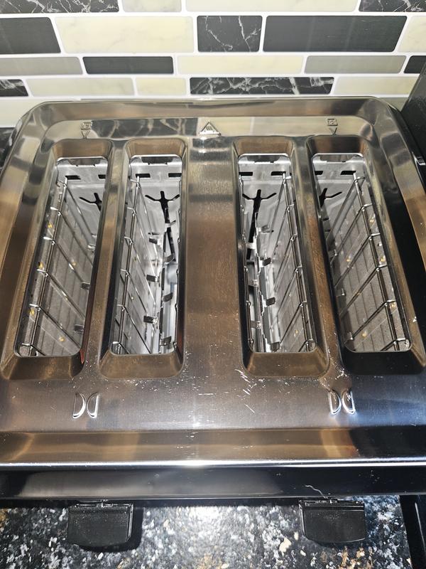 Slots are great size and can lift them up higher than our last toaster, for easy access.