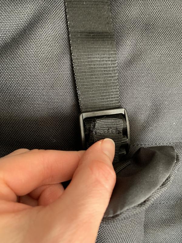 Difficult to fit strap cover back through buckle after adjusting strap height.