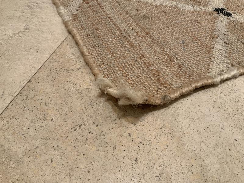 Edges continually curls and won’t lie flat.  Weave is coming apart