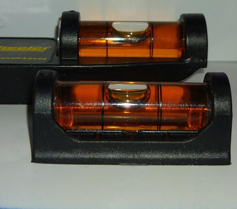 Note the difference in the level position on a precision flate surface.  Fluid is clearer than normally appears as I used a super bright flash to take the photo.