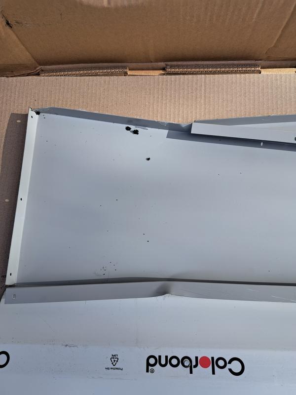 Dented front gable which had dirt inside box