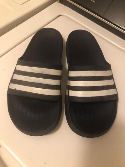 Customer photo for "I’ve gone through 3 pairs over 10-12 years my favorite slides"