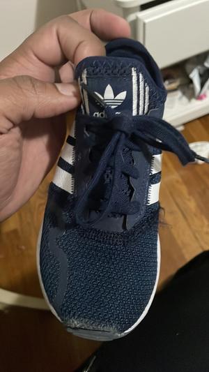 Customer photo for "I bought this for my toddler who walks to school with his sibling. He wore them for the first time today and upon return the material had fallen apart"