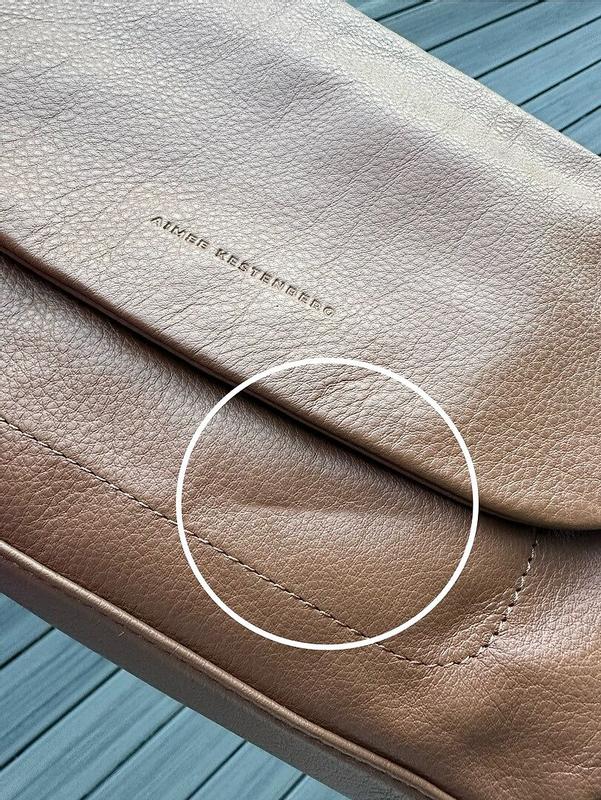Customer photo for "5cm defect in the leather, but otherwise great"