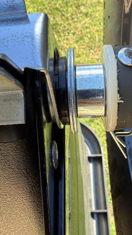 metal close plate attached to axle, large wiggle room space can be seen