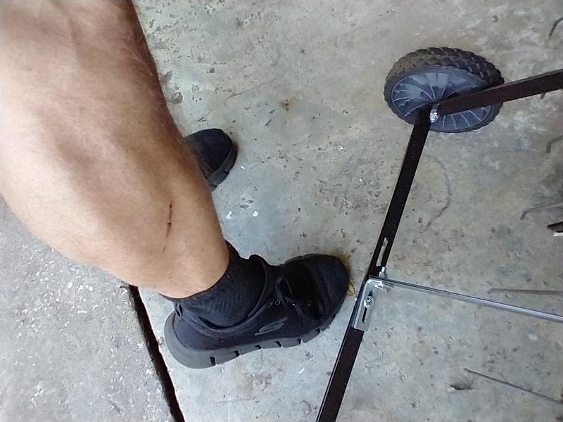 Gotcha! Walking around the back end. Duh! Mowing in shorts. It's still hot here in Fl.